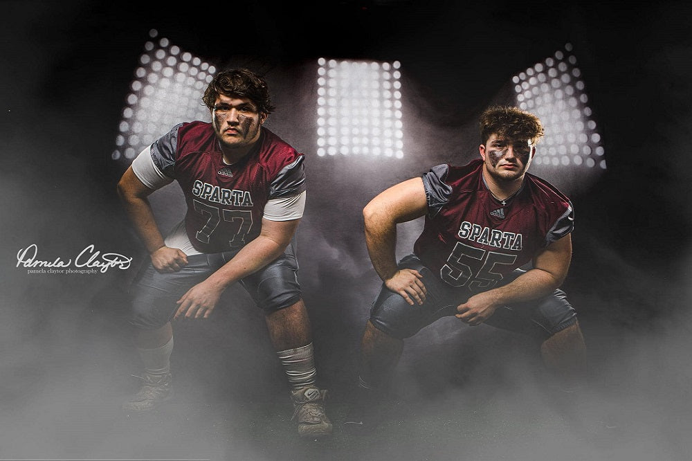 Two male athletes standing in front of Foggy Light Backdrop