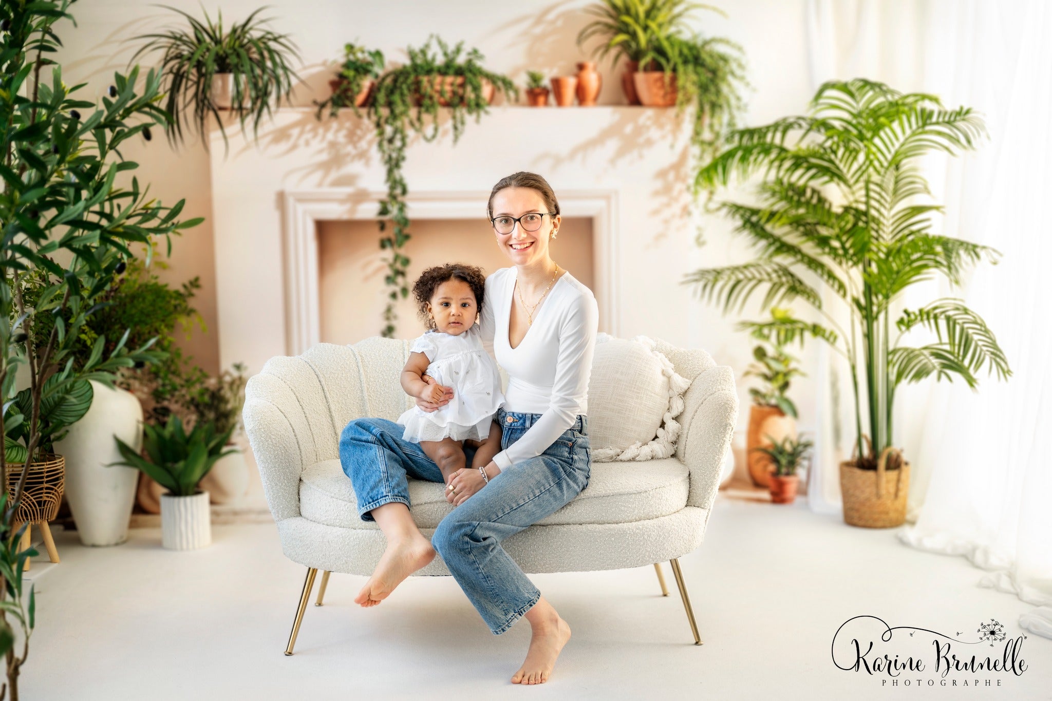 Kate White Fireplace With Spring Greenery Backdrop Designed by Emetselch