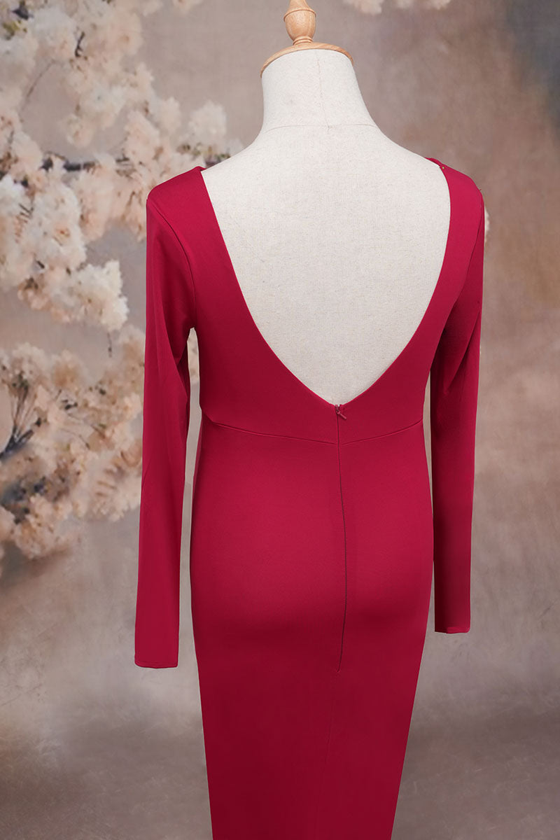 Detail shot of the back of a red long sleeve satin maternity dress