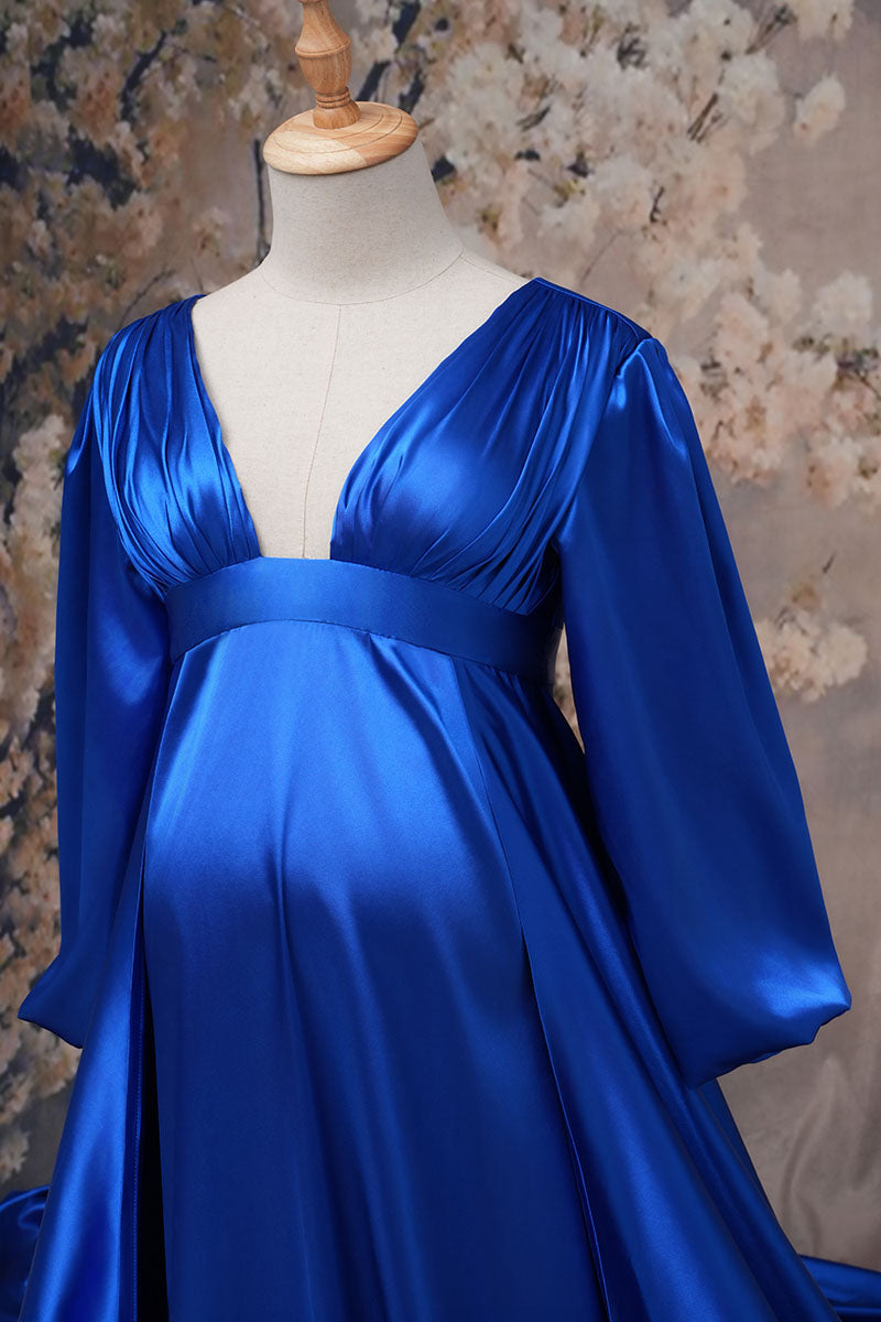Detail shot of blue long sleeve satin maternity dress