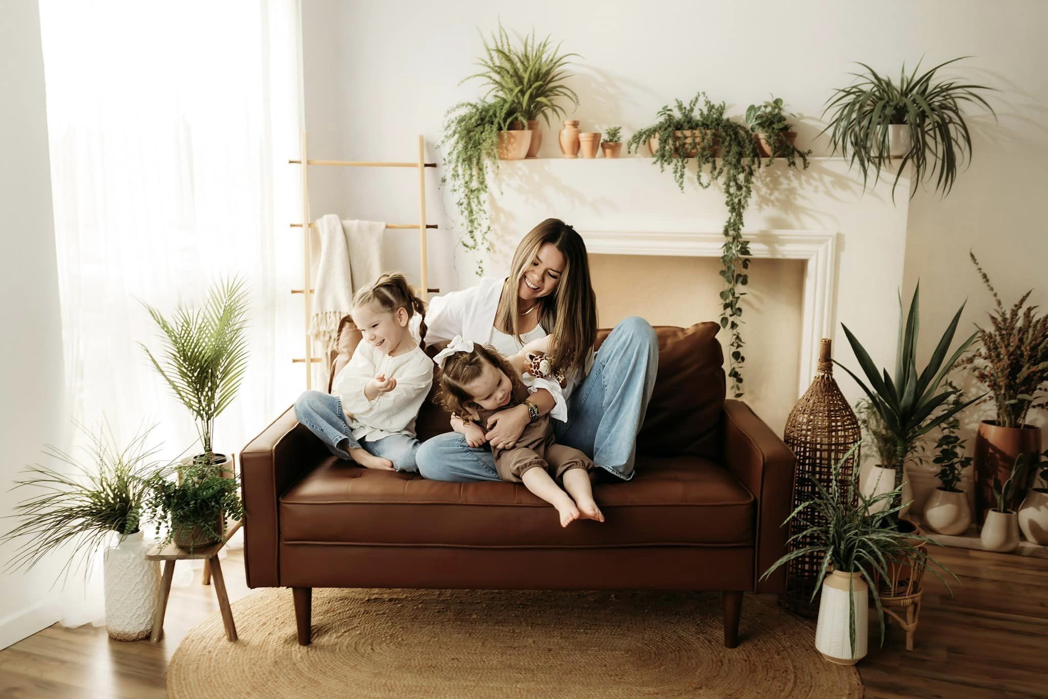 Kate White Fireplace With Spring Greenery Backdrop Designed by Emetselch