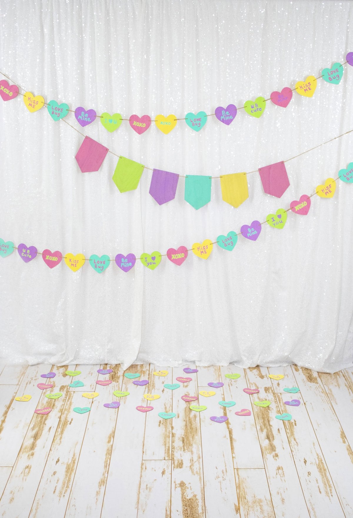 Kate White Curtain with Colored Banners Valentine's Day Backdrop Designed by Leann West